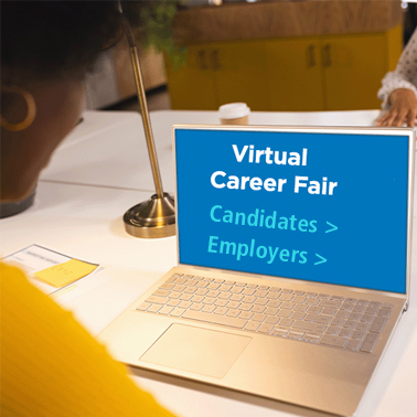 woman looking at a laptop screen with virtual career fair 
